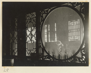 Temple interior at Xi yu si showing a partition with latticework