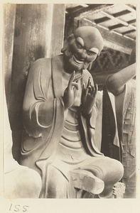 Interior of Luohan tang at Bi yun si showing a statue of a Luohan