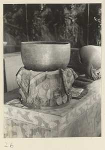 Musical instruments resting on altar cloths with embroidered votive offerings at Xi yu si