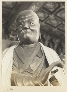 Interior of Luohan tang at Bi yun si showing detail of a draped statue of a Luohan