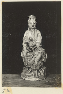 Statue of a woman holding a child at Xi yu si