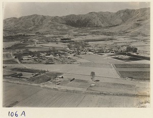 Fields and mountains seen from the hillock of the Hei long tan