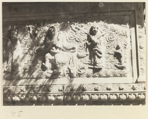 Detail of Jin gang ta at Bi yun si showing relief panel with Buddhist scene