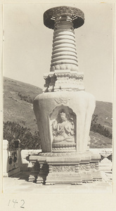 Stupa-type pagoda with multi-armed Bodhisattva on Jin gang ta at Bi yun si