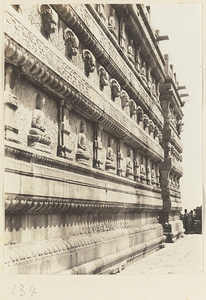 Detail of Jin gang ta showing relief carvings of Buddha figures and animal heads at Bi yun si