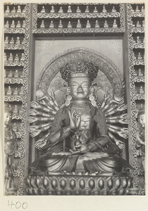 Temple interior showing a statue of a multi-armed Boddhisattva at Wan shou si