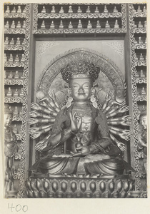 Temple interior showing a statue of a multi-armed Boddhisattva at Wan shou si