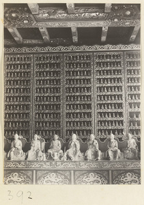 Temple interior showing seven Luohans and wall with Buddha reliefs at Wan shou si