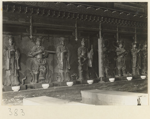 Interior view of temple building showing eight shrine figures and inscription at Da jue si