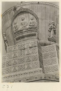 Detail of a stupa-style pagoda showing reliefs with three Buddhas flanked by Bodhisattvas at Huang si