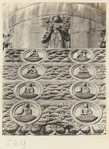 Detail of a stupa-style pagoda showing relief figures of a Bodhisattva and Buddhas at Huang si
