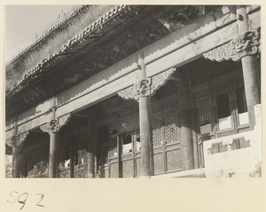 Facade detail of double-eaved temple building showing capitals with animal heads at Huang si