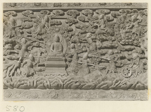 Detail of a pagoda showing a relief carving with a Buddhist scene at Huang si