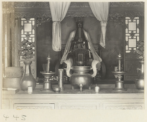 Altar with Daoist statue and ritual objects at Bai yun guan