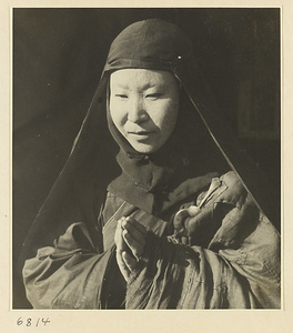 Buddhist nun praying