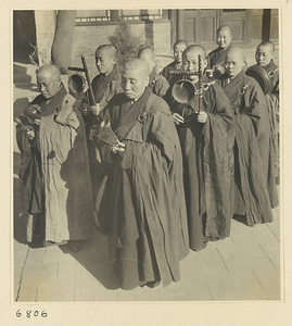 Procession of Buddhist nuns playing musical instruments