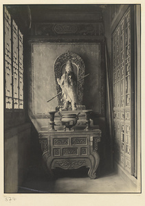 Interior of Wan shan dian showing altar with shrine figure carrying a staff