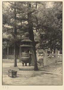 Courtyard at Wan shan dian showing metal incense burner on marble pedestal