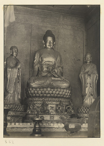 Interior of Wan shan dian showing central section of main altar with statues of Buddha and attendants