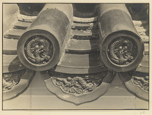 Detail of roof tiles showing relief work with dragon motif at Tian tan