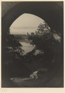 Zhong lou (left) and Gu lou (right) seen through moon gate in Beihai Gong Yuan