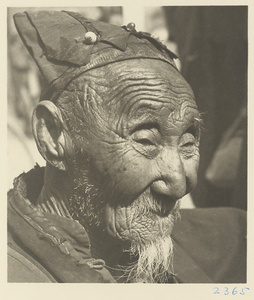 Daoist priest wearing a hat at Bai yun guan