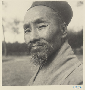 Daoist priest wearing a hat at Bai yun guan