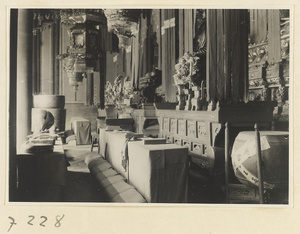 Interior view of temple building at Jie tai si showing altars with musical instruments and lanterns at Jie tai si