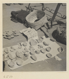 Cake molds displayed at a market