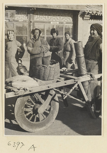 Muslim candy vendor with cart and copper sign