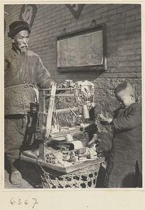 Toy vendor, display stand, and boy holding a toy