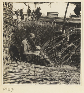 Man weaving a basket