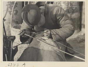 Itinerant ceramic repairman at work