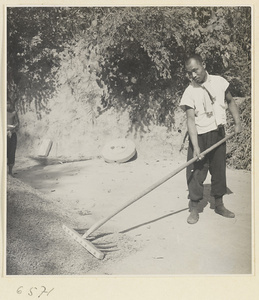 Man raking grain