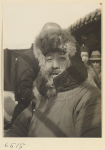 Man wearing a fur-lined hat