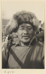 Man wearing a fur hat