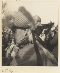 Man wearing a quilted, fur-lined hat