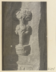 Carved door stone with floral motif