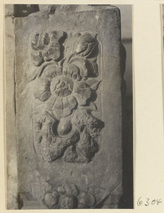 Carved door stone with floral motif