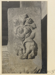 Carved door stone with floral motif