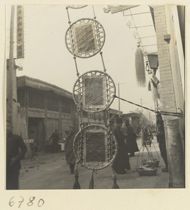 Shop signs for unidentified shop (center) and hemp worker's shop that sells rope, cord, and string (right)