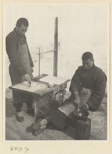 Tracery candy maker at his stand heating candy on a stove