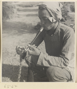 Farmworker smoking a pipe