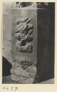 Carved door stone with dragon and carp motifs and animal finial