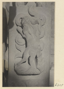 Carved door stone with animal motif