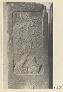 Carved door stone with floral motif