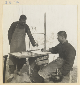 Customer buying tracery candy from a candy vendor at his stand