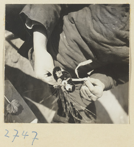 Woman making chenille souvenirs