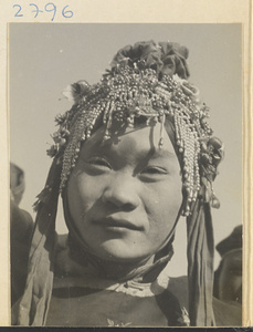 Soldier in costume wearing a beaded headdress at New Year's