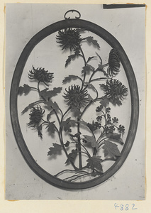 Iron picture of flowers in an oval frame